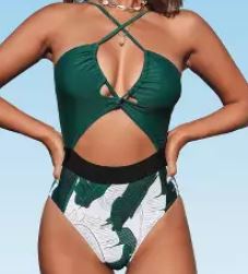 One piece bathing suit with crisscross neckline and cut out in the front. Green coloring with palm tree designs 